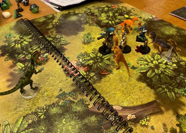 Dinosaurs vs PC minis on jungle themed battle mat