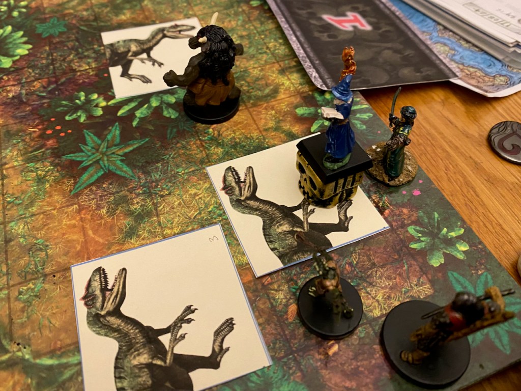 Jungle battle mat with PC minis and allosaurus counters