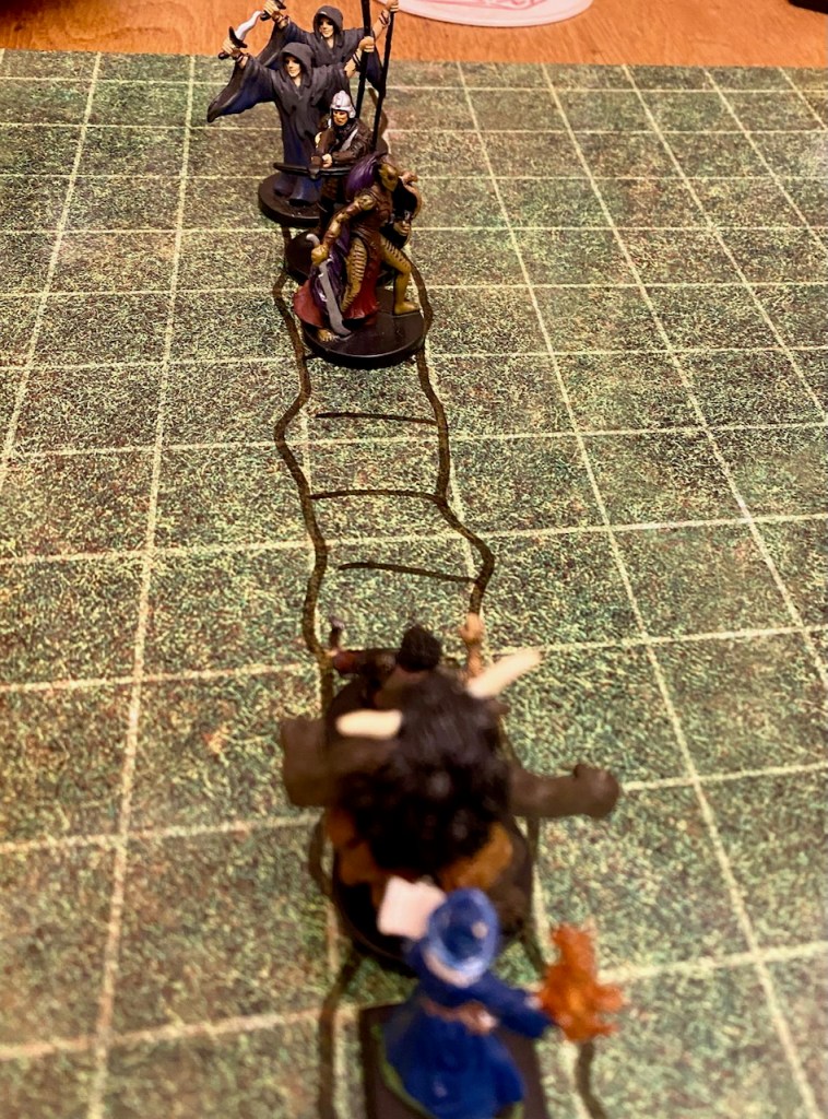 PC minis vs cultists on hand drawn battle map of rope bridge