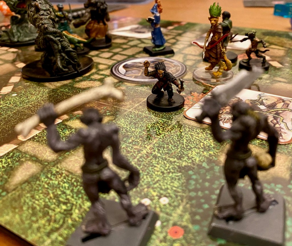 PC minis vs ghoul and plant creature minis on a battle map