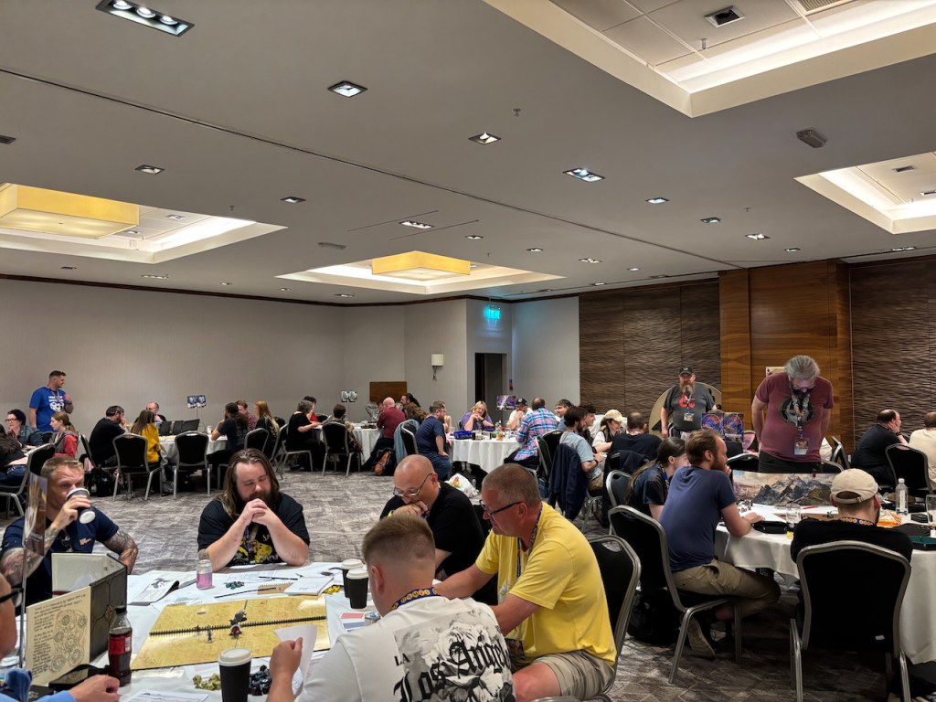 Tables of gamers playing D&D at the Epic