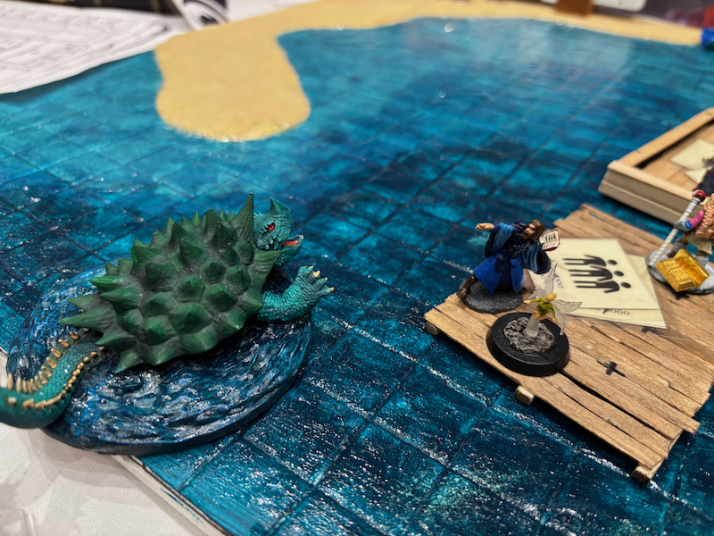 PC wizard & fairy minis on handmade wooden raft battling a dragon turtle in the water